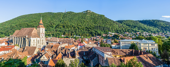 Brasov, Romania - September 02 2023: Panoramic view with Council Square (Piata Sfatului) in the old town city of Brasov and Mount Tampa in the background