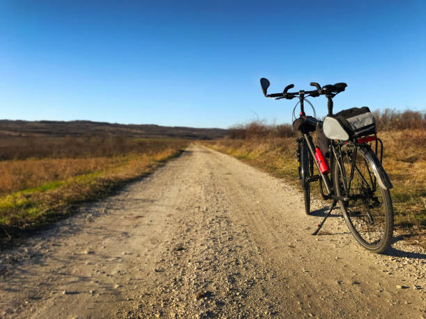 istock Black bike parked on the road side 1965320495