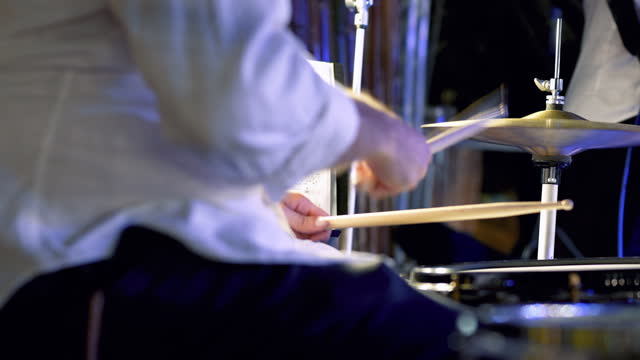 Playing live jazz concert: the drummer in action