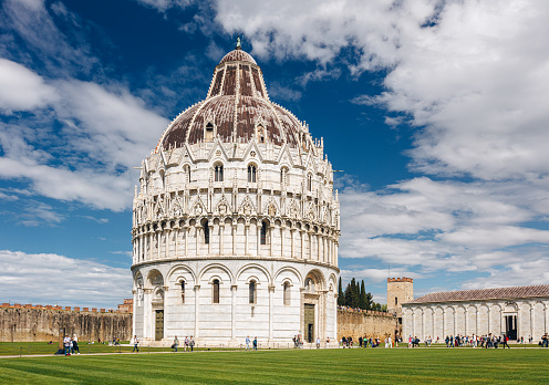 The Pisa Baptistery of St. John (Italian: Battistero di San Giovanni) is a Roman Catholic ecclesiastical building in Pisa, Italy. Construction started in 1152 to replace an older baptistery, and when it was completed in 1363, it became the second building, in chronological order, in the Piazza dei Miracoli, near the Duomo di Pisa and the cathedral's free-standing campanile, the famous Leaning Tower of Pisa. The baptistery was designed by Diotisalvi, whose signature can be read on two pillars inside the building, with the date 1153.