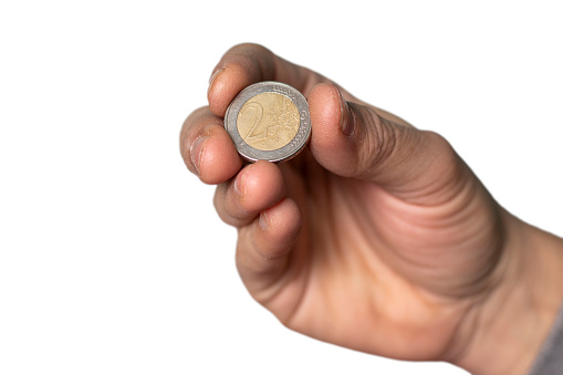 Two Euro Coin Hold by Man Hand, on White Background