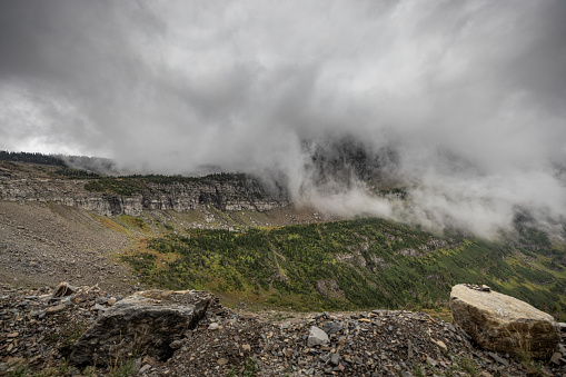 Fog and rain creating moody conditions in the Mountains of Glacier National Park, Montana.