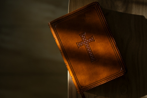 Holy Bible on wooden background