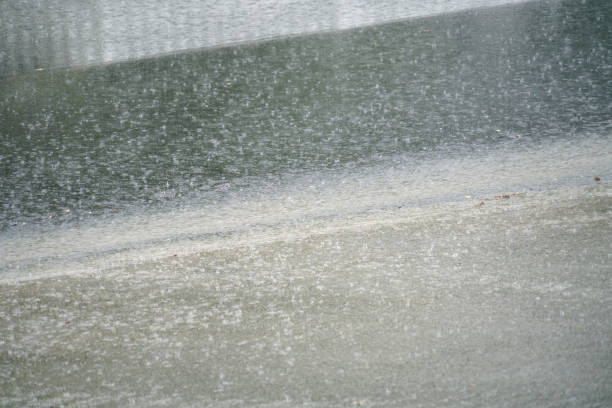 close up on raining street in thunderstorm