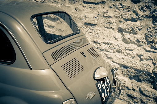 Gubbio Italy - May 13 2011; Vintage image effect of back end of classic olf small Itaian car.