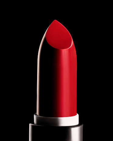 Red lipstick closeup on black background
