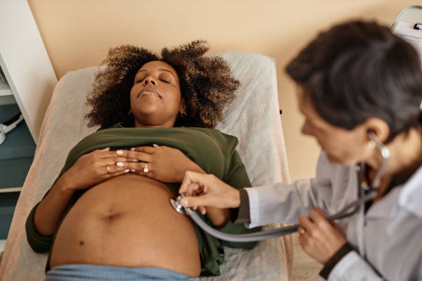 istock Expectant Mother Lying down during Abdomen Examination 1965472218