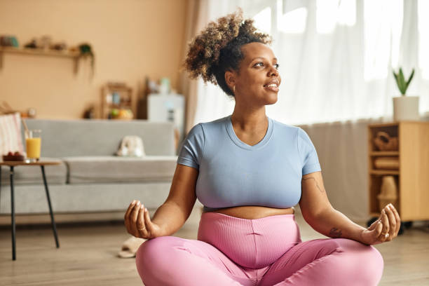 istock Happy Expectant Mother Meditating at Home 1965472792