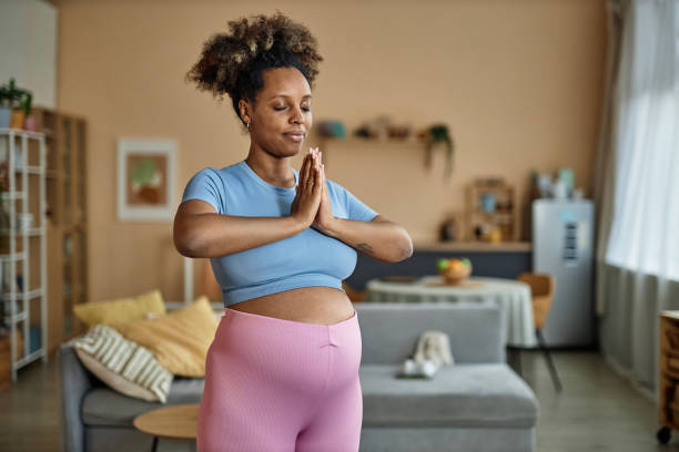 Relaxed Pregnant Woman Exercising at Home
