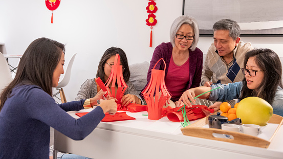 Family makes New Years lanterns together for Chinese New Year
