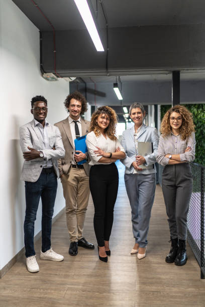 istock A group of successful multiethnic business team at work looking at camera 1965509940