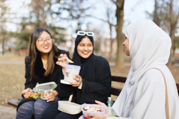 istock Female friends having fun while eating healthy food 1965515729
