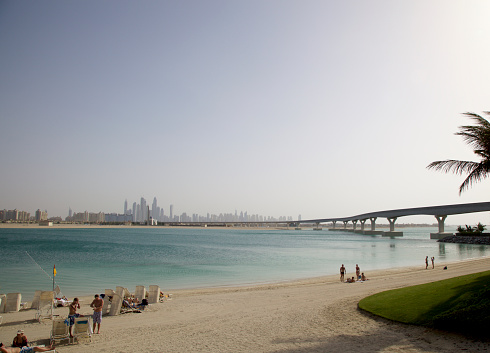 Dubai, United Arab Emirates - January 14, 2013: Aquaventure Beach and Dubai skyline and cityscape, Palm Jumeirah.