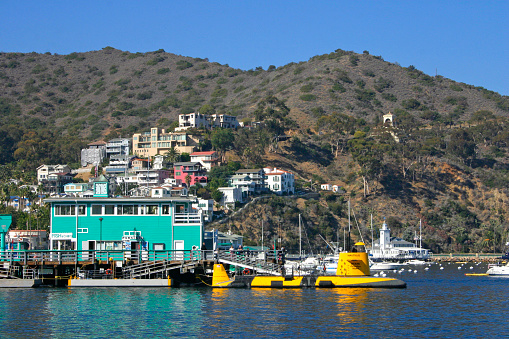 USA, California, Catalina Island - November 24, 2009:  view of the city of Avalon and coastal marinas and buildings for housing