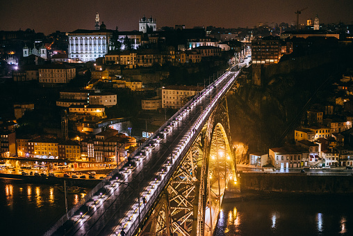 Nighttime view of Dom Luis I bridge over Douro river in Porto, Portugal