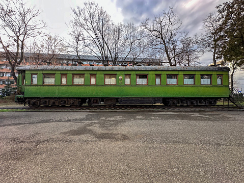 Abandoned old railway wagons at station. Old train wagons