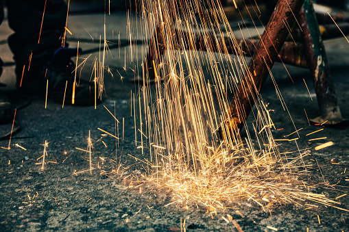 Sparks from grinding in metallurgy factory.