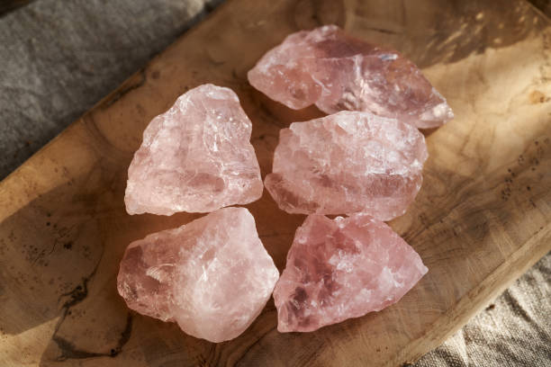 istock Pink rose quartz stones on a table 1965627307