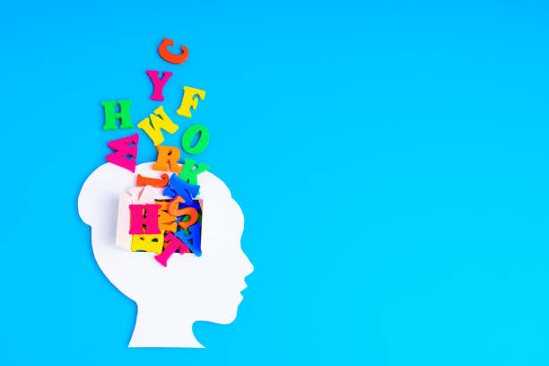 istock Paper-Cut Female Head with Letter Cascade on Blue 1965645276