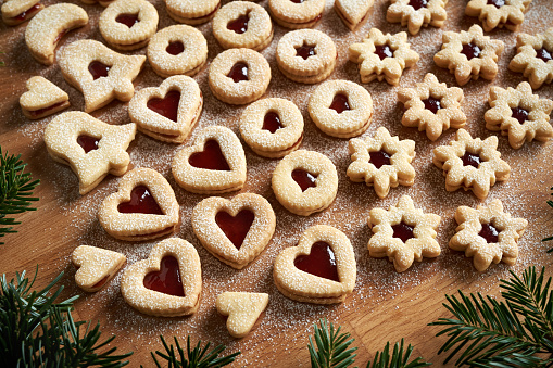 Homemade Linzer Christmas cookies on a wooden table