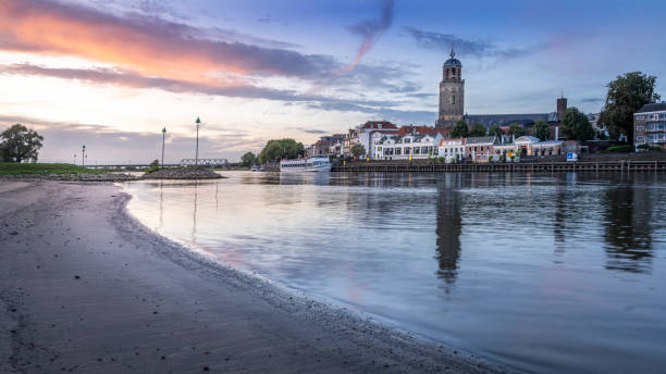 istock there is a lighthouse that is on the shore by the water 1965708382