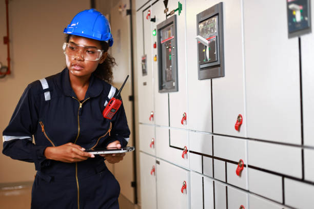 istock Woman in Manufacturing, female electrical engineer daily check MDB ,electrical control room 1965713687
