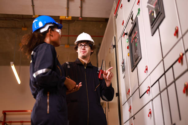 istock A couple of electrical engineers working in the electrical control room, Main Distribution Board 1965714198