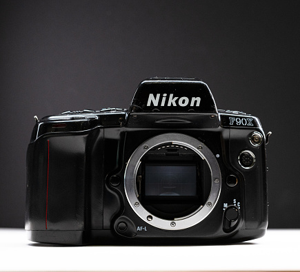 Gothenburg, Sweden - november 15 2023: Nikon F90X analogue SLR photographic camera on a white table.