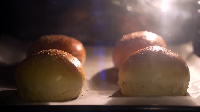 Timelapse of burger buns with sesame seeds baking