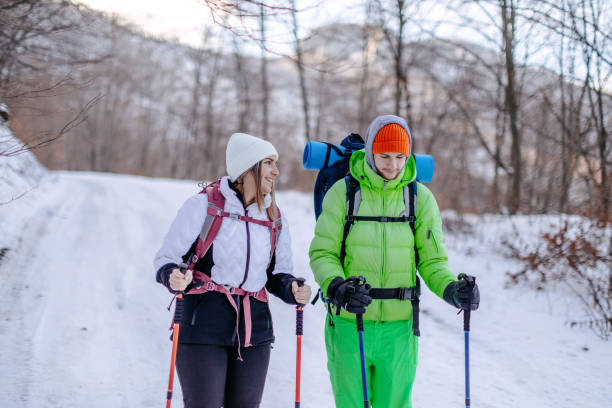 istock Couple hiking on snow during winter 1965824316