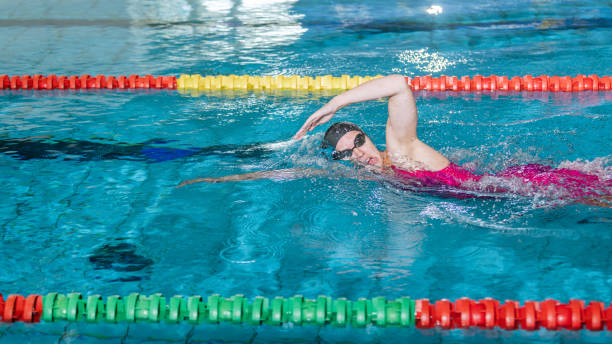 istock Elite female swimmer during a front crawl swimming training 1965838352