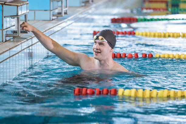 istock Man swimmer happy at the finish in the pool 1965842006