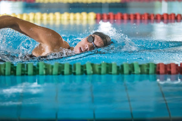 istock Elite female swimmer during a front crawl swimming training 1965848287