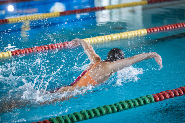 istock Female swimmer moving through the water performs a butterfly stroke 1965867778