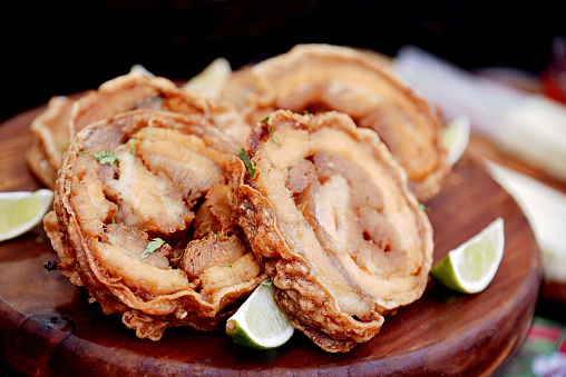 Close-up of fried roll cracklings. Crispy Pork Belly (crackling) is a popular dish in Brazil and Latin America.