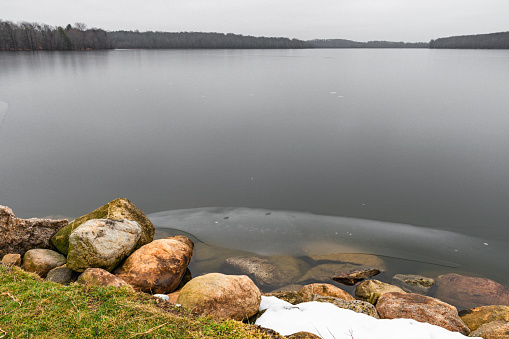 Ice Covered Reservoir on Rainy Day