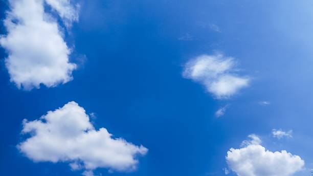 istock beautiful texture of bright blue sky with white clouds.  bright blue sky background 1965944834