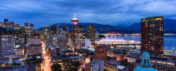 Downtown Vancouver City at night after sunset. Aerial Panorama. Downtown Vancouver City at night after sunset. Aerial Panorama. BC, Canada. vancouver at night stock pictures, royalty-free photos & images
