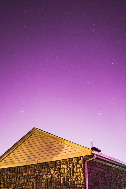 Purple Starry Nightsky behind Stone House