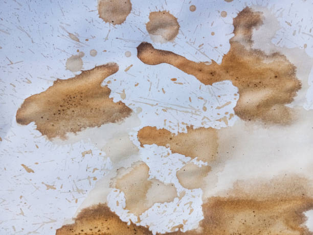 istock Abstract brown coffee grunge background. Hand made abstract artwork. Abstract brown paint wallpaper. Coffee stains and drops on white paper. 1966018108