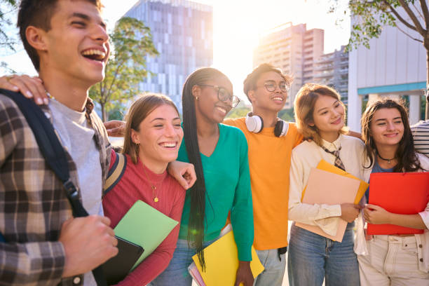 istock Happy young multiracial university students posing together taking a photo 1966023747