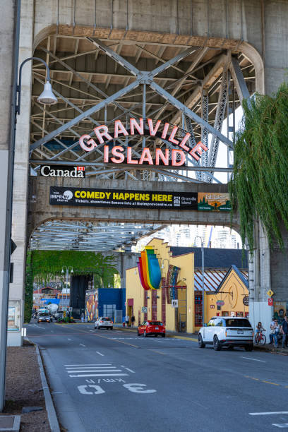 Granville Island Sign The famous neon light Granville Island sign marking the entrance of Granville Island in Vancouver, British Columbia. granville island stock pictures, royalty-free photos & images