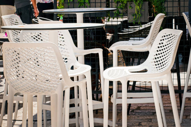 istock wicker bar stools and table illuminated by the sun at a street cafe 1966049786