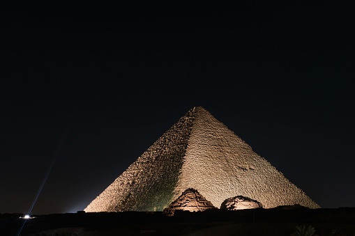 Giza, Egypt - December 12 2023: The Great Pyramid Khufu (Pyramid of Cheops) is the oldest and largest of the three pyramids in the Giza at night