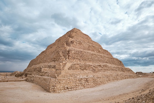 Saqqara, Egypt - December 13 2023: The Pyramid of Djoser (or Djeser and Zoser), or Step Pyramid in the Saqqara necropolis