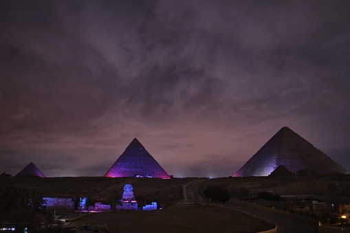 Giza, Egypt - December 13 2023: Colourful light shows on ancient Giza Pyramids