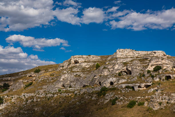 Matera, located in the Basilicata region of southern Italy, is a UNESCO World Heritage site known for its unique ancient cave dwellings carved into the rocky landscape. These cave homes, known as \