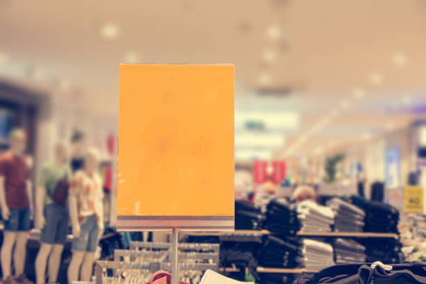 Blank discount sign on aisle in clothes store
