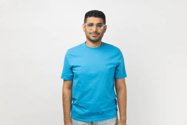 istock Smiling positive man wearing optical eyeglasses standing looking at camera with positive expression. 1966119328