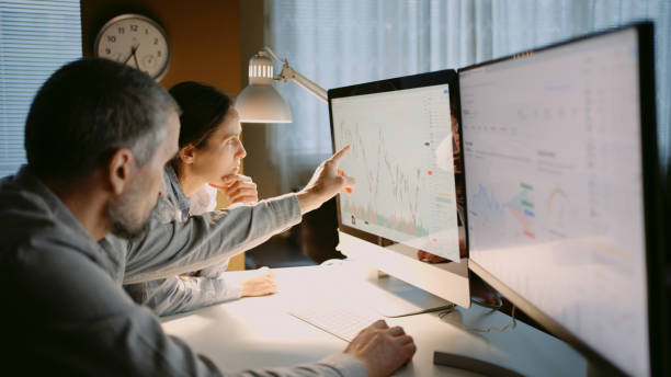 istock Stock trading. Family team using TradingView app at home office. 1966125183